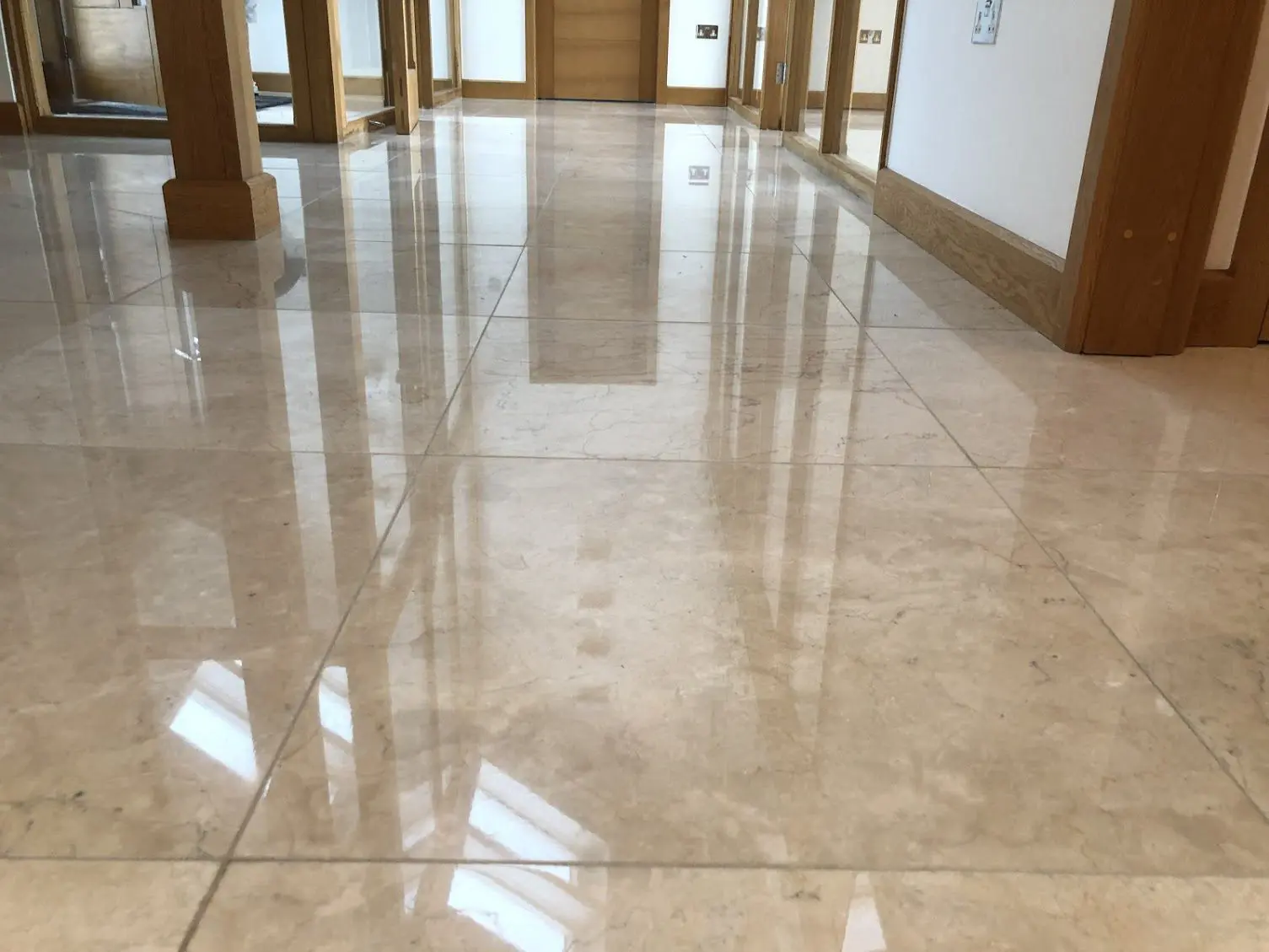Crema Marfil Marble floor re-polished to a high gloss finish by hardfloor restoration marble floor cleaning services. Marble polishing Manchester.