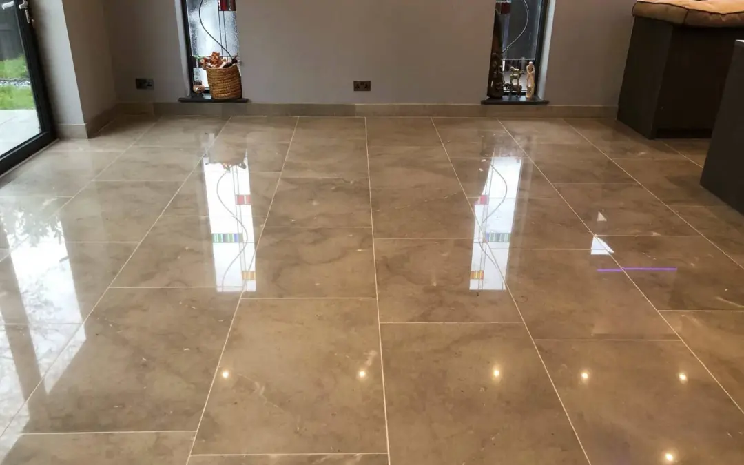 Reflective Limestone floor restoration by Hardfloor Restoration Ltd with visible spotlights and bi-fold door reflections, indicating high-quality polishing services. stone floor cleaning Marble polishing & limestone polishing service in Manchester