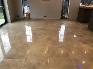 Limestone Floor Polishing by Hardfloor Restoration Ltd - Pristine & Reflective • Stone floor restoration, Manchester | Hardfloor Restoration Reflective limestone floor restoration by Hardfloor Restoration Ltd with visible spotlights and bi-fold door reflections, indicating high-quality polishing services.