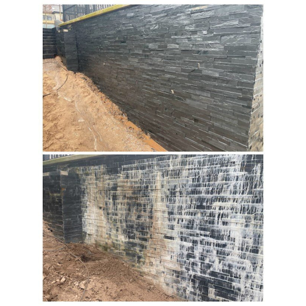 Slate salts removed, cement remover and efflorescence remover before and after image on a slate cladded wall.