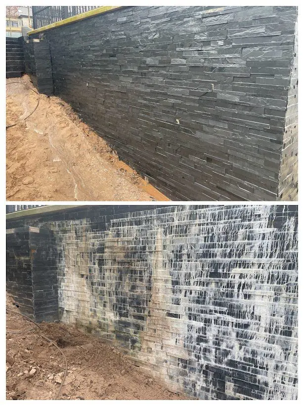 Slate salts removed, cement remover and efflorescence remover before and after image on a slate cladded wall.