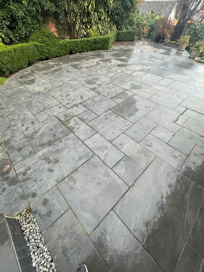Unsealed porcelain patio before treatment, showing dull and unclean surfaces.