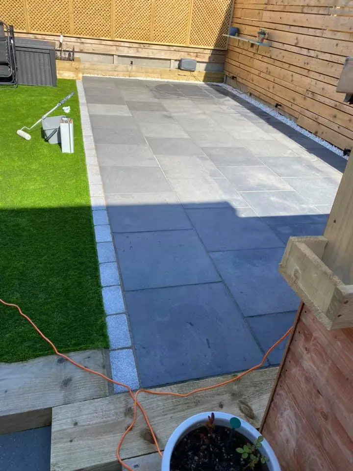Untreated black limestone patio before HR Colour Enhancer sealing. 