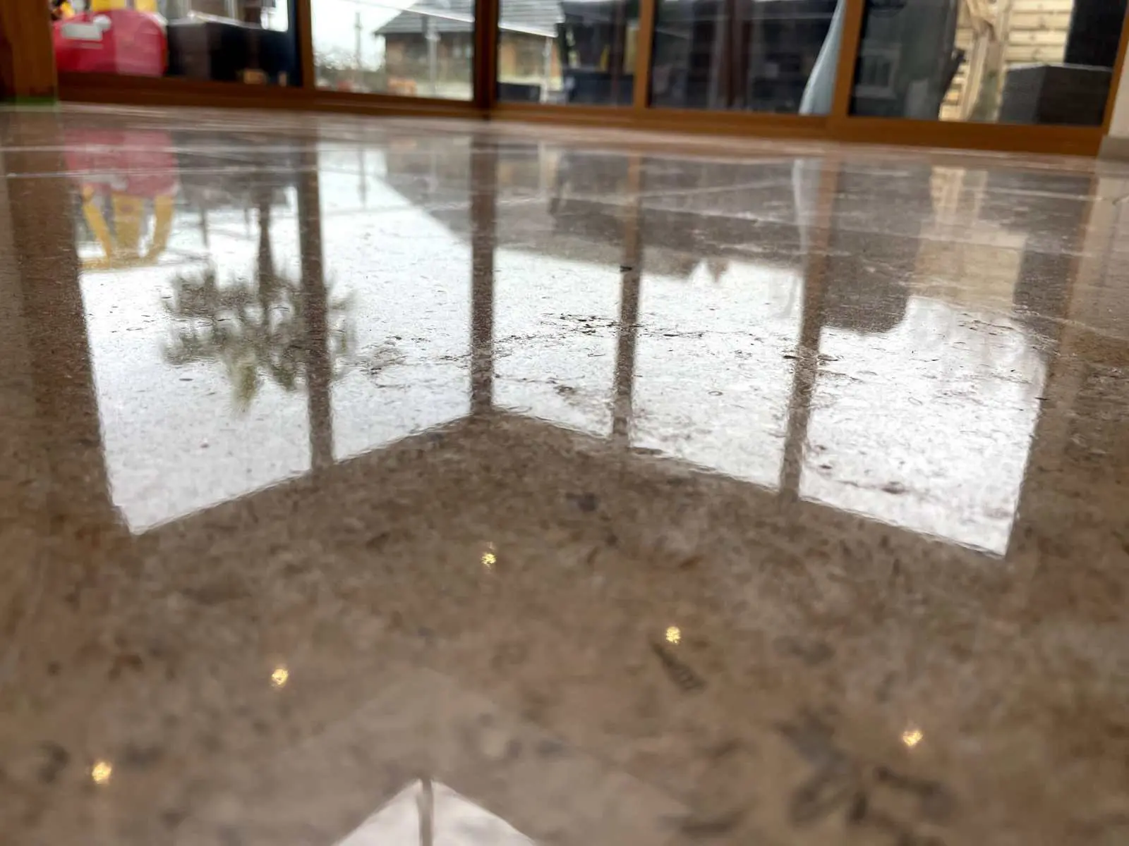 highly polished travertine floor after Hardfloor restoration ltd have preformed their Stone floor cleaning service to bring this floor back to life