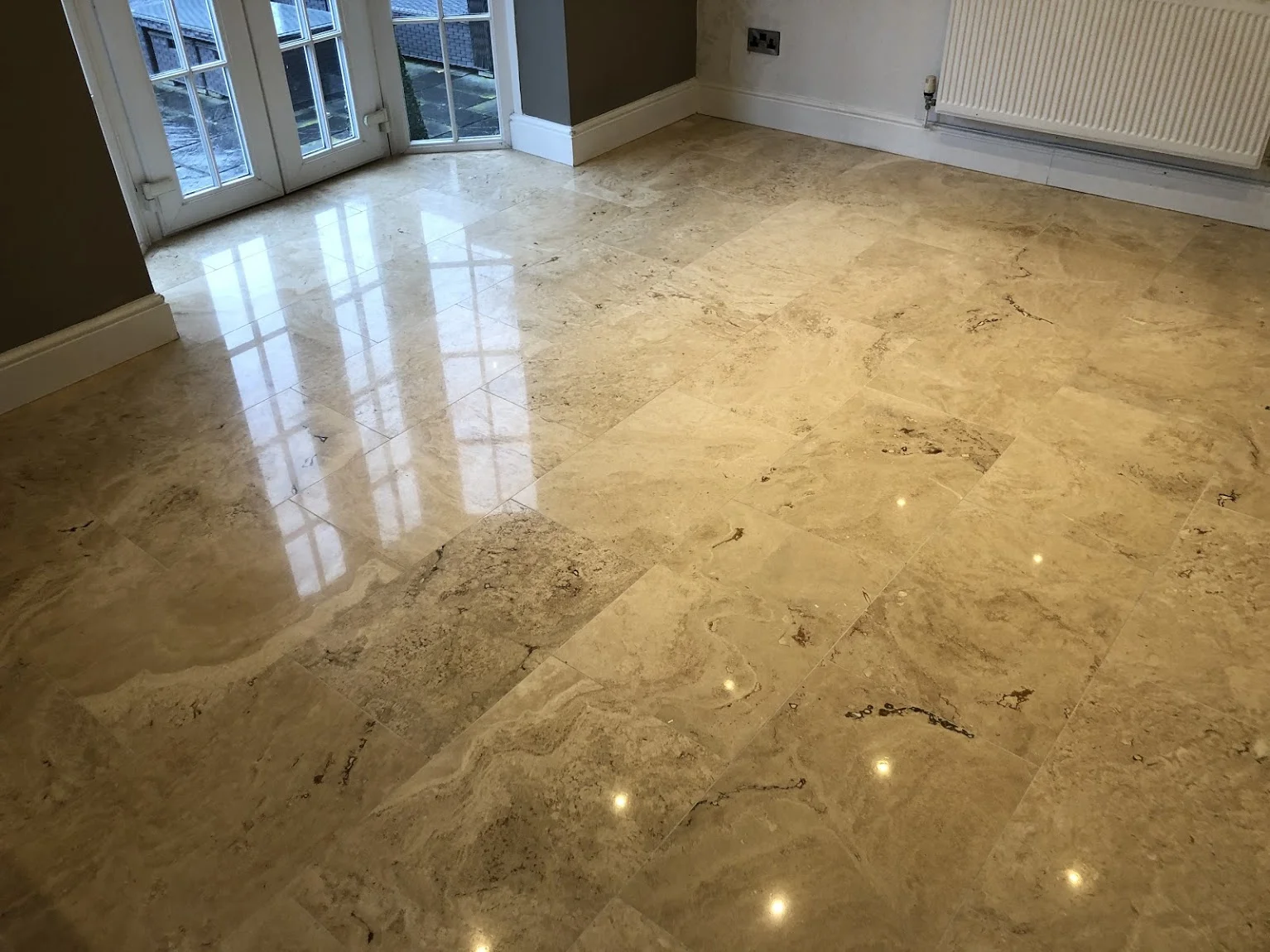 travertine hole and crack repair, then re-polished to a high gloss finish.