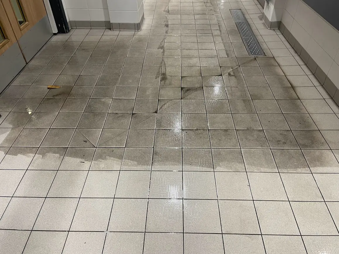 Body fats, dirt, grease and grime being removed from Oldham swimming baths floor as hardfloor restoration use there Commercial Cleaning Services