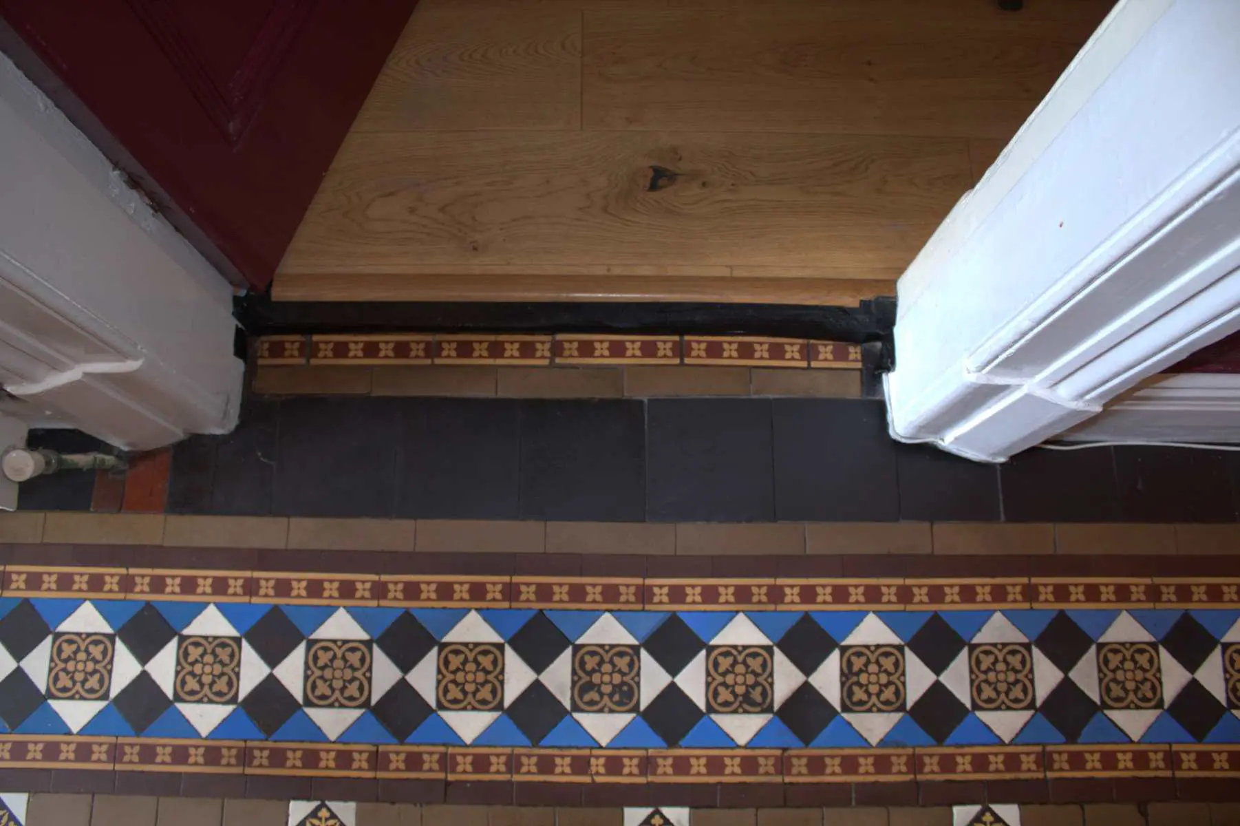 replaced Victorian TIles in a door way.