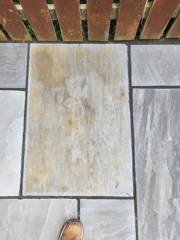 Patio rust removed from sandstone patio Kandla Grey Sandstone patio with rust and iron staining in the stone that has now been removed with HR Rust Off. the best patio rust remover.