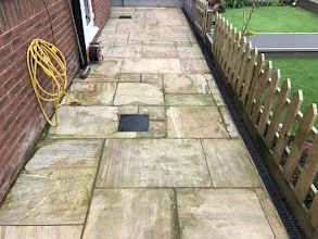 Dirty Indian sandstone patio before cleaning
