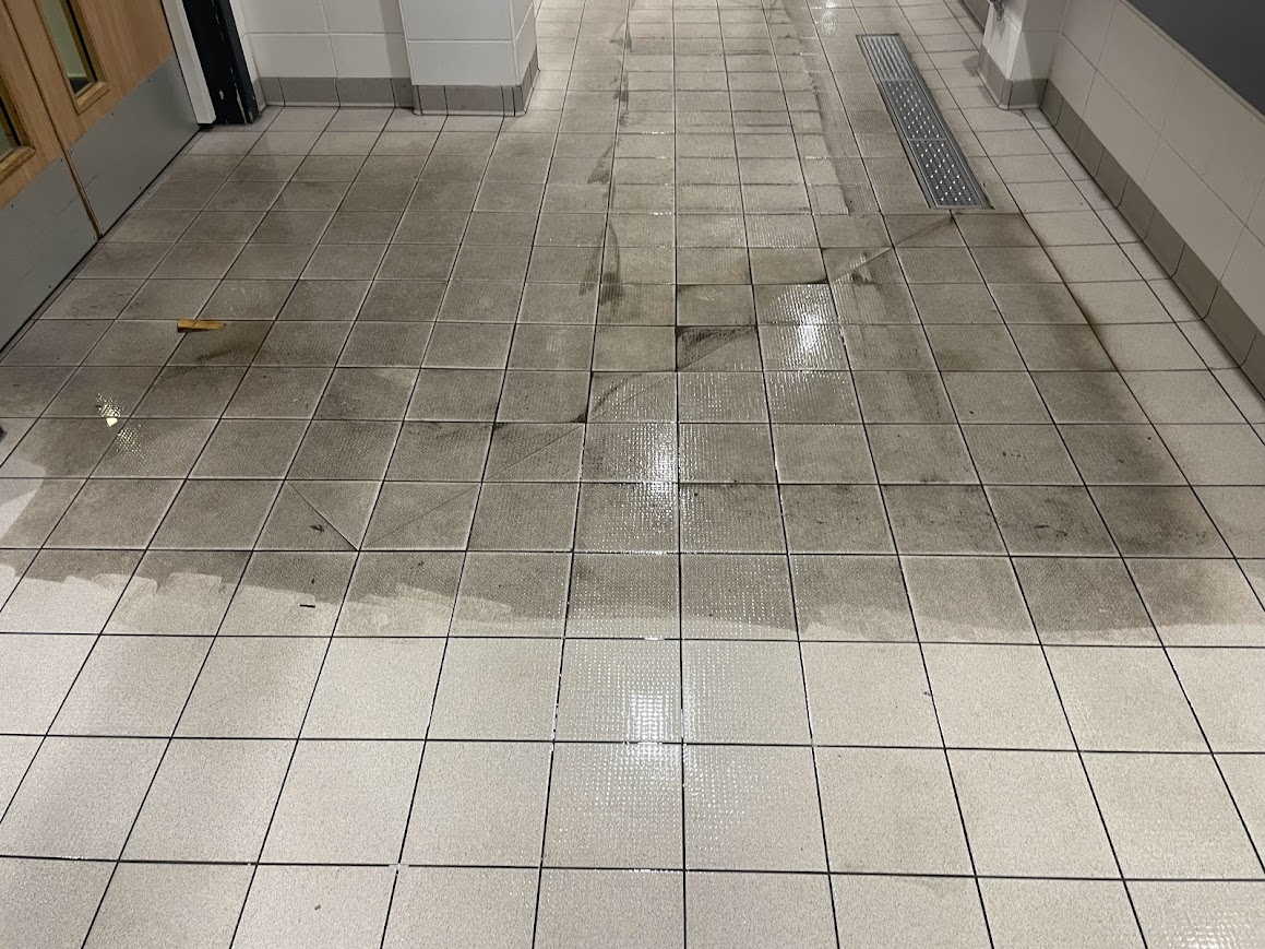 Contamination removed during commercial swimming baths floor cleaning