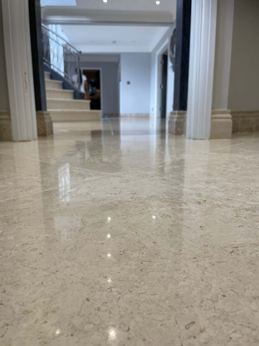 Crema Marfil marble floor professionally polished to restore its shine