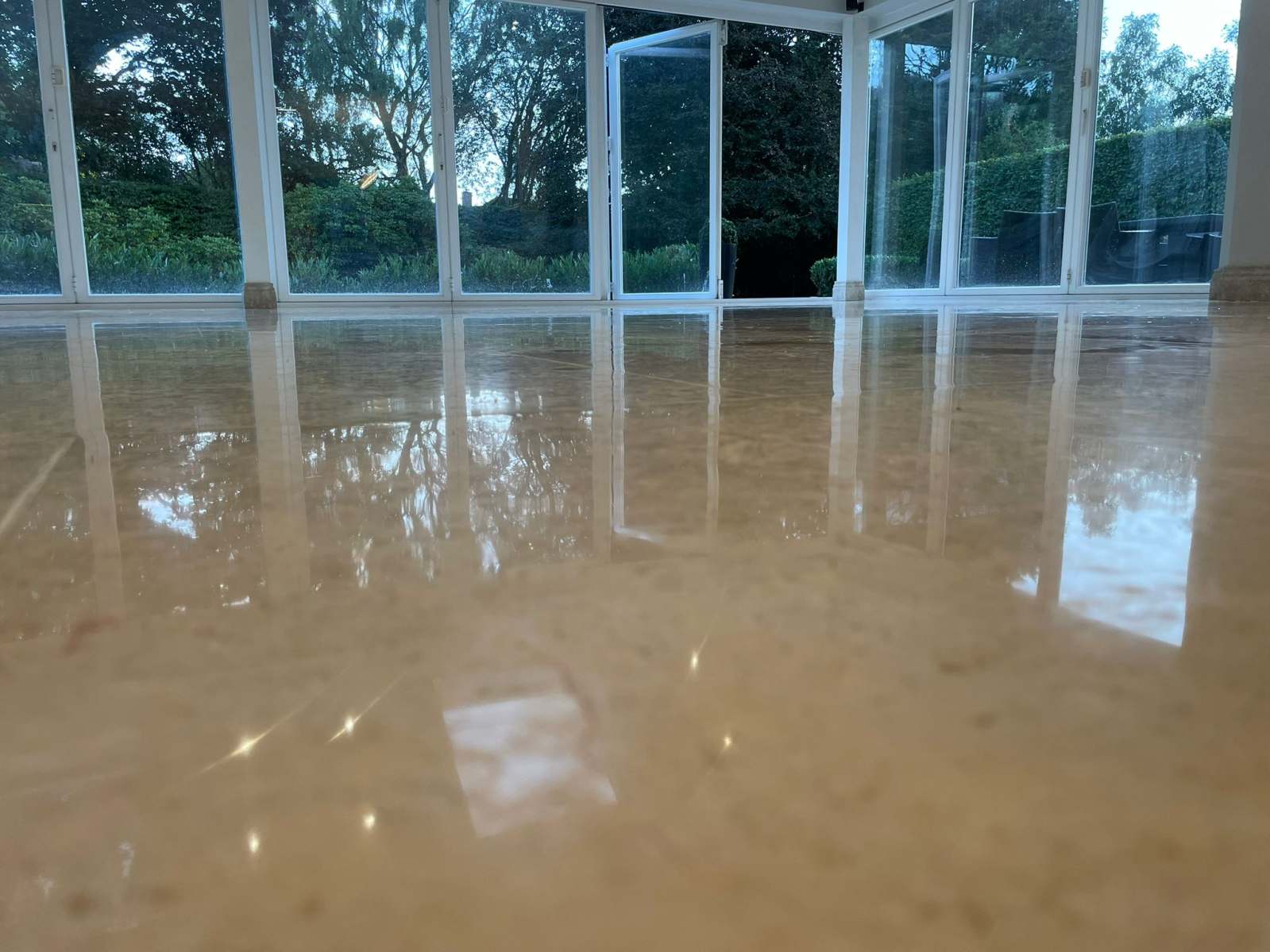Marble floor professionally honed and polished to restore an even reflective finish