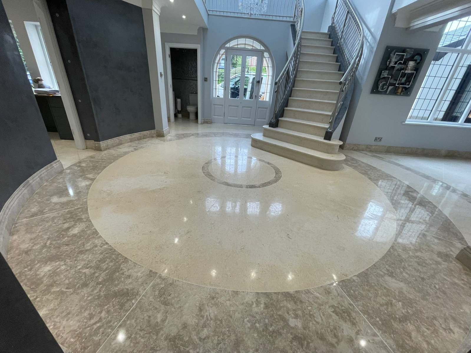 High gloss marble floor polishing in a large entrance hall
