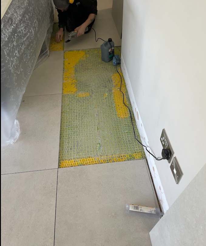 Local porcelain floor tile replacement during repair work
