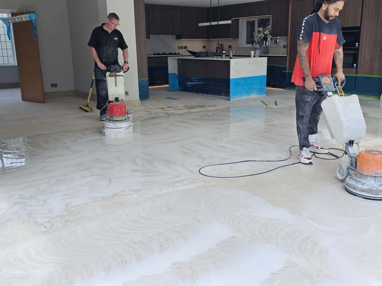 Grinding and polishing a marble floor during restoration